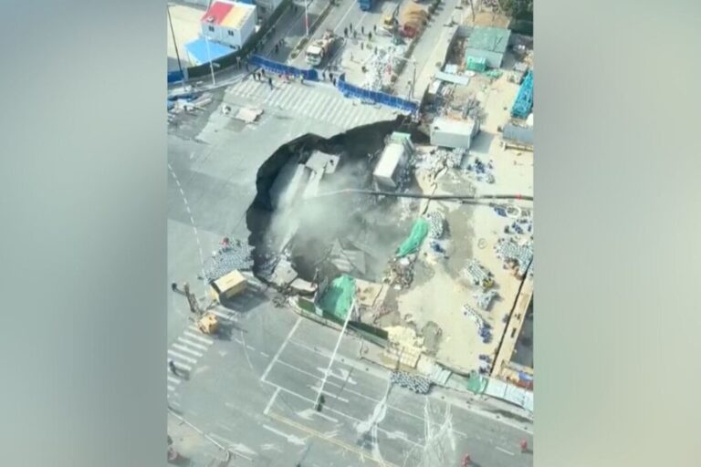 massive-sinkhole-opens-up-on-street-in-china