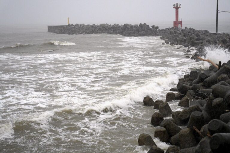2-tropical-storms-pound-japan-with-floods-and-landslides,-killing-1