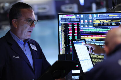 dow-jones-closes-above-46,000-for-1st-time-as-wall-street-bets-on-rate-cuts